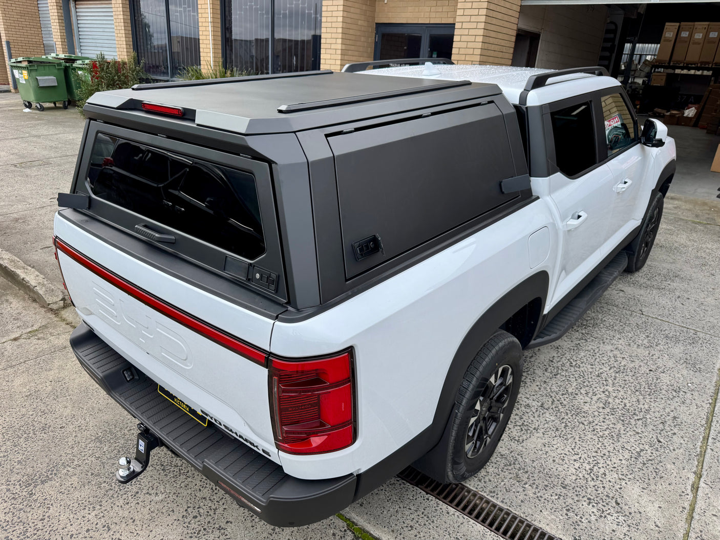 BYD Shark 6 steel canopy — passenger-side three-quarter view showing brushed finish