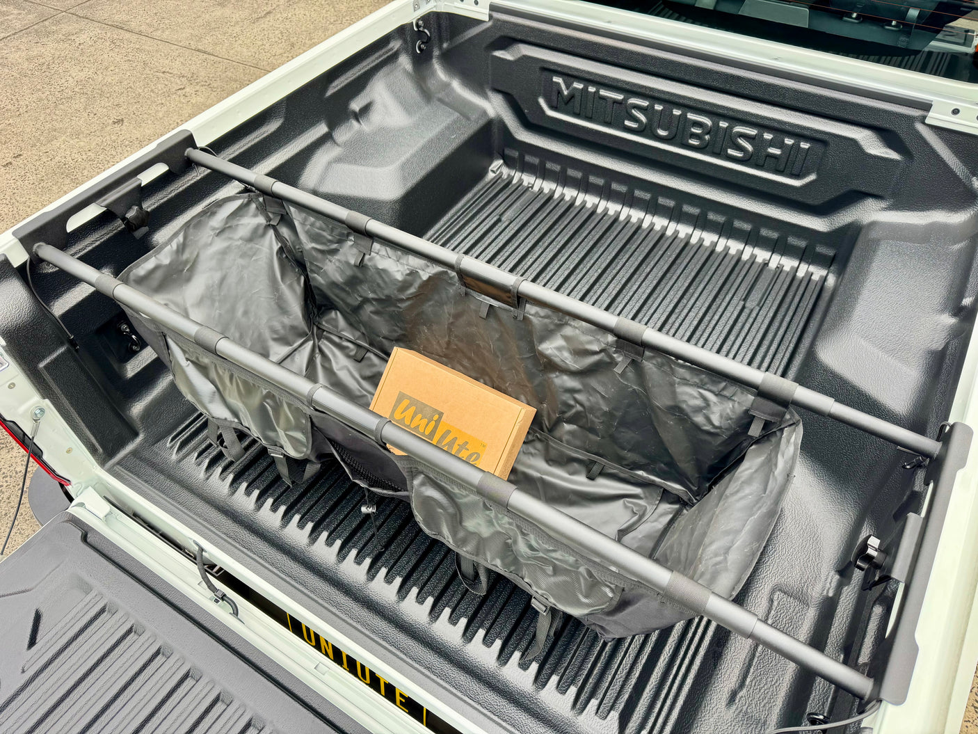 Ute tub organiser hammock — universal fit shown installed in ute tray | UniUte