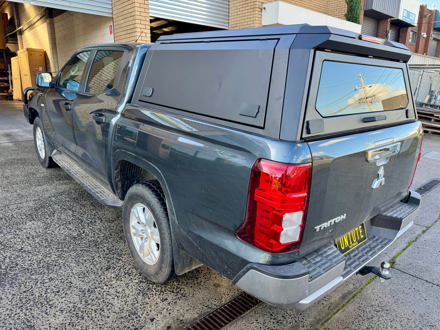 Mitsubishi Triton MV canopy — close-up of the brushed stainless steel finish