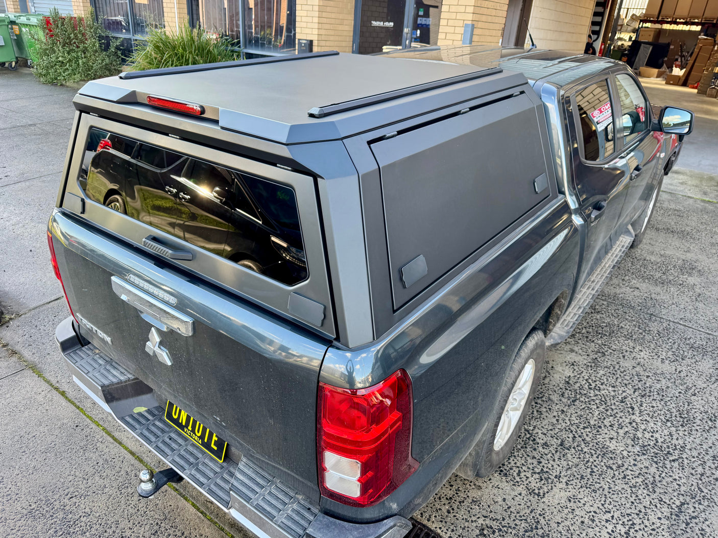 Triton MV stainless steel canopy — close-up of the lift-up side window and seal