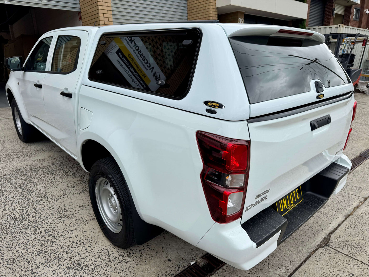 Rear view of a dual cab Isuzu D-Max with FORCE PRO canopy dmax upgrade, featuring robust design for durability and style.