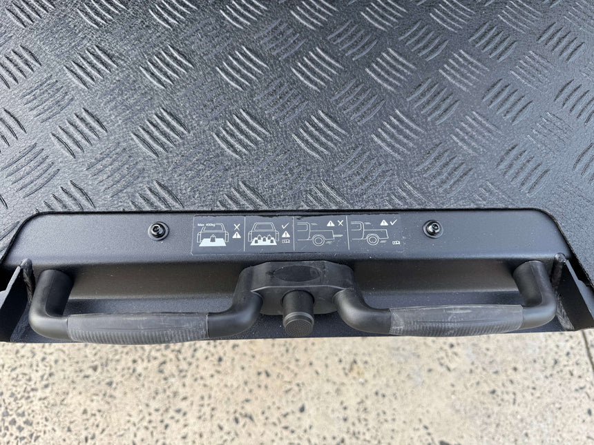 Ute tray slide for Isuzu D-Max 2012-2025 showing handle and textured surface design.