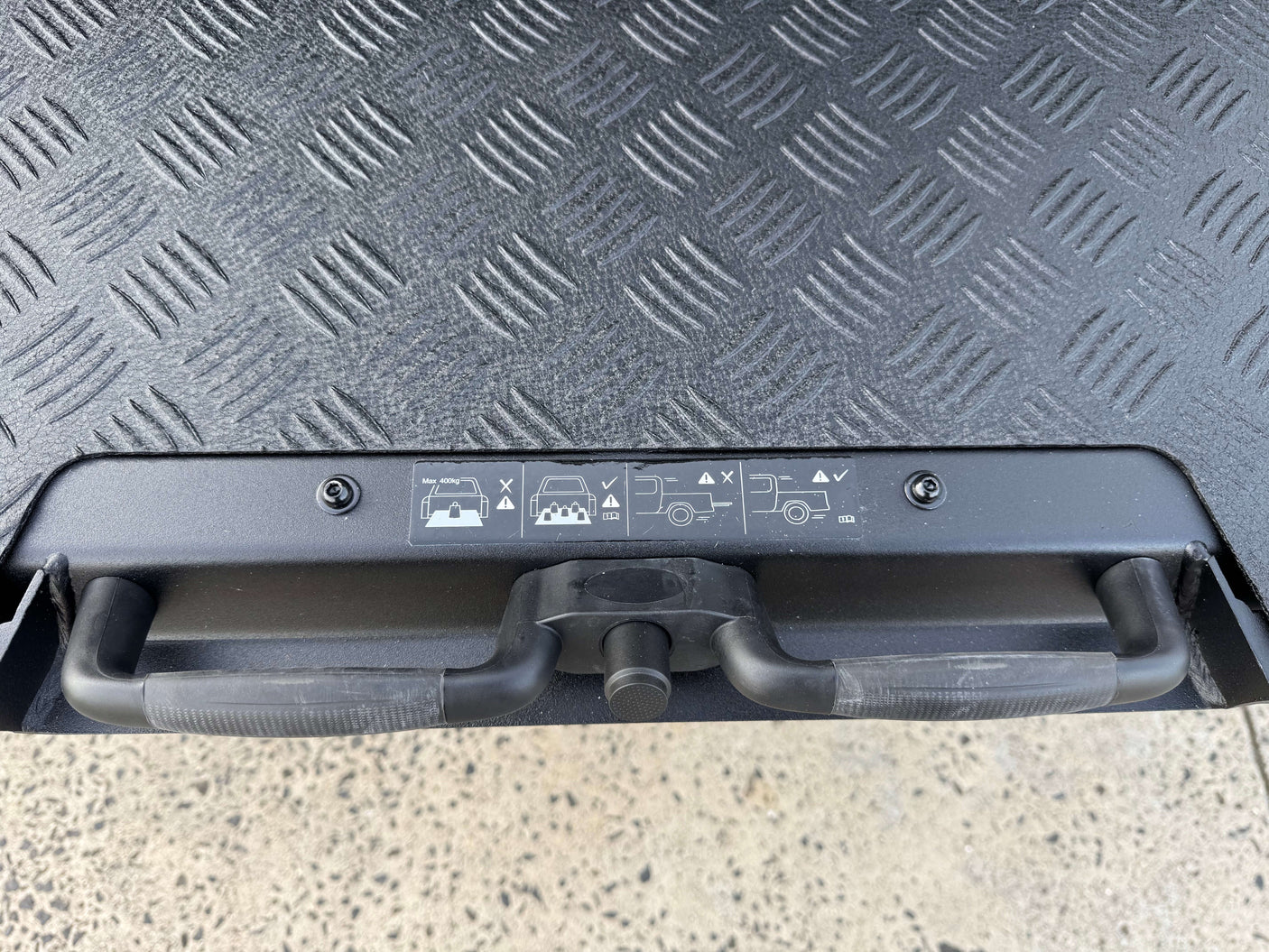 Ute tray slide for Isuzu D-Max 2012-2025 showing handle and textured surface design.