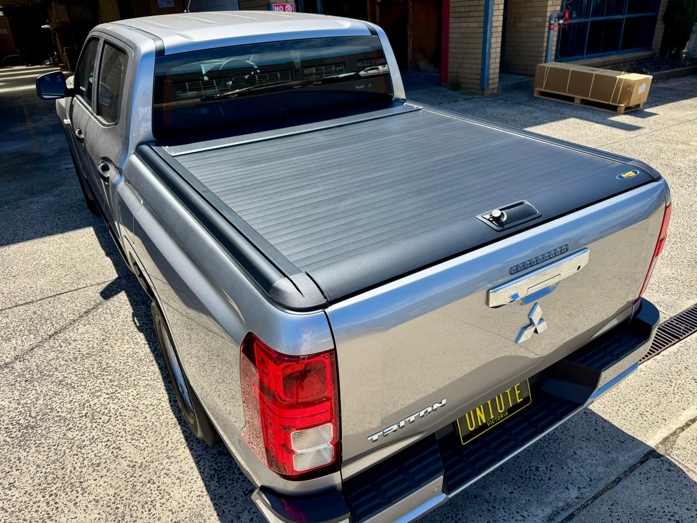 Triton MV 2024+ roller shutter — rear three-quarter view installed