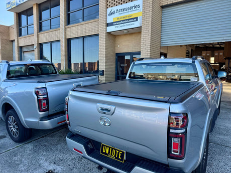 GWM Cannon Roller Shutter by UniUte parked outside accessories shop.