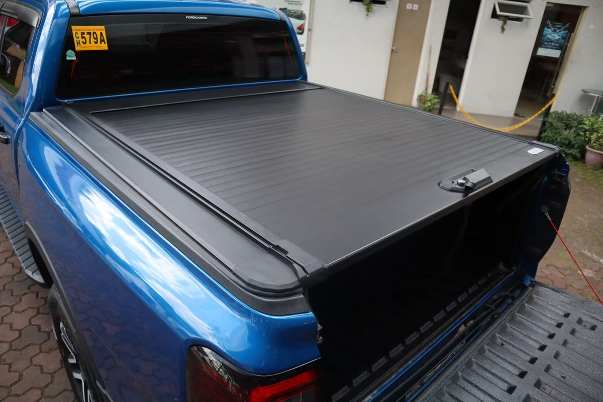 HERO Lid roller shutter on Ford Ranger NextGen — rear three-quarter view closed