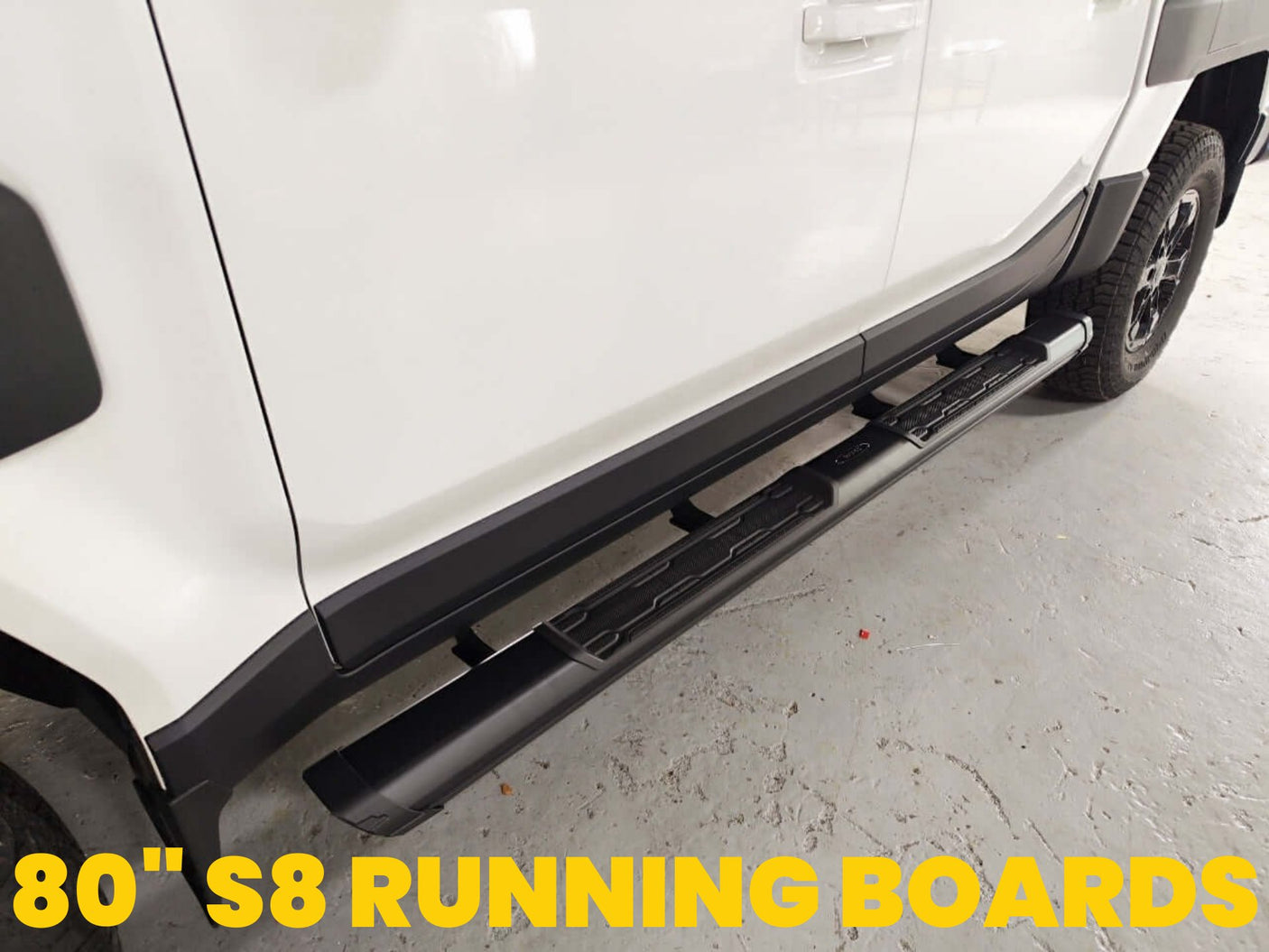 Close-up of KIA Tasman side steps 2025+, black steel side bars on a white vehicle for enhanced access and style