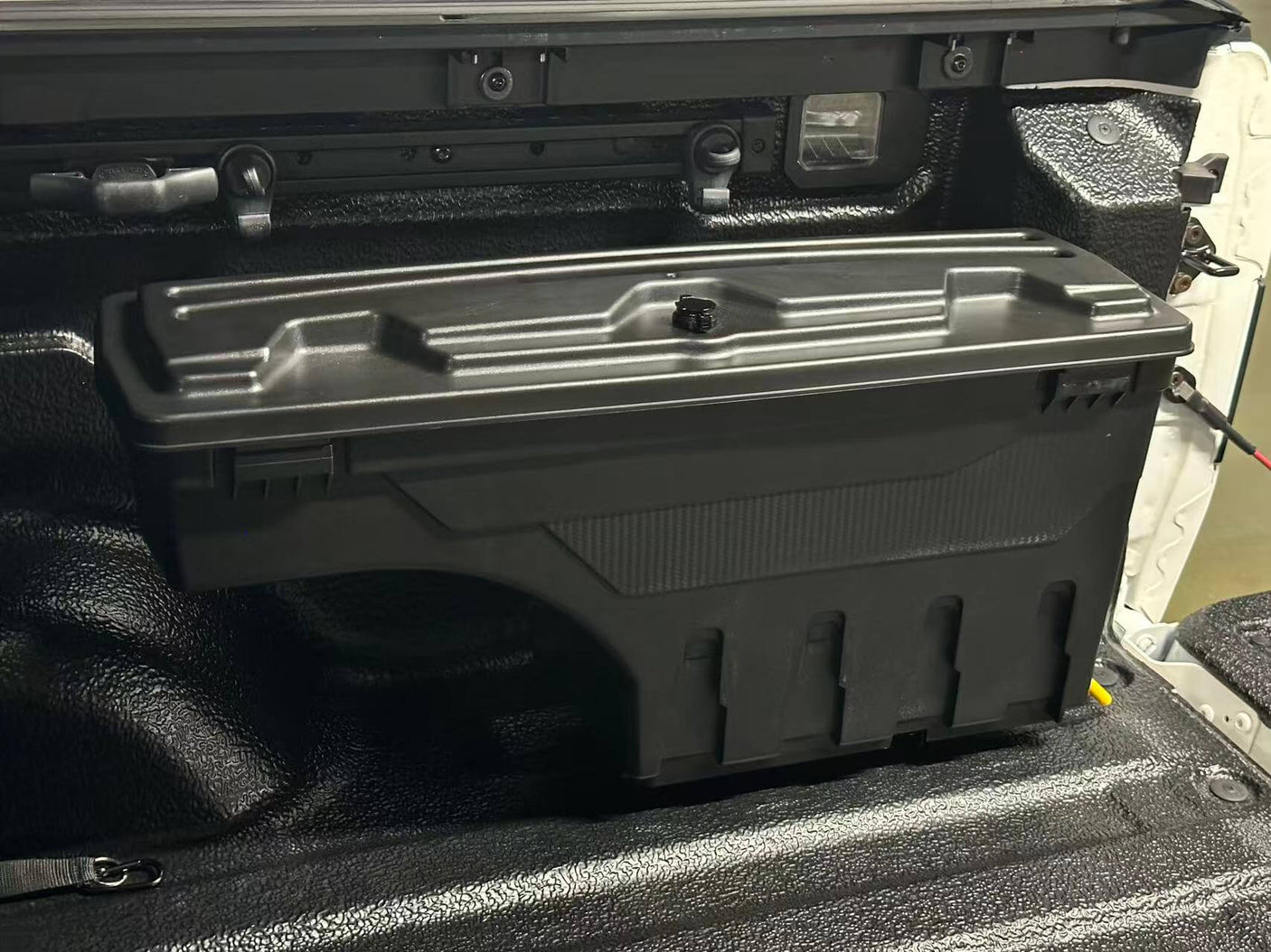 KIA Tasman Tool Box 2025+ smart swing-out ute storage for secure and accessible gear organization in vehicle tub
