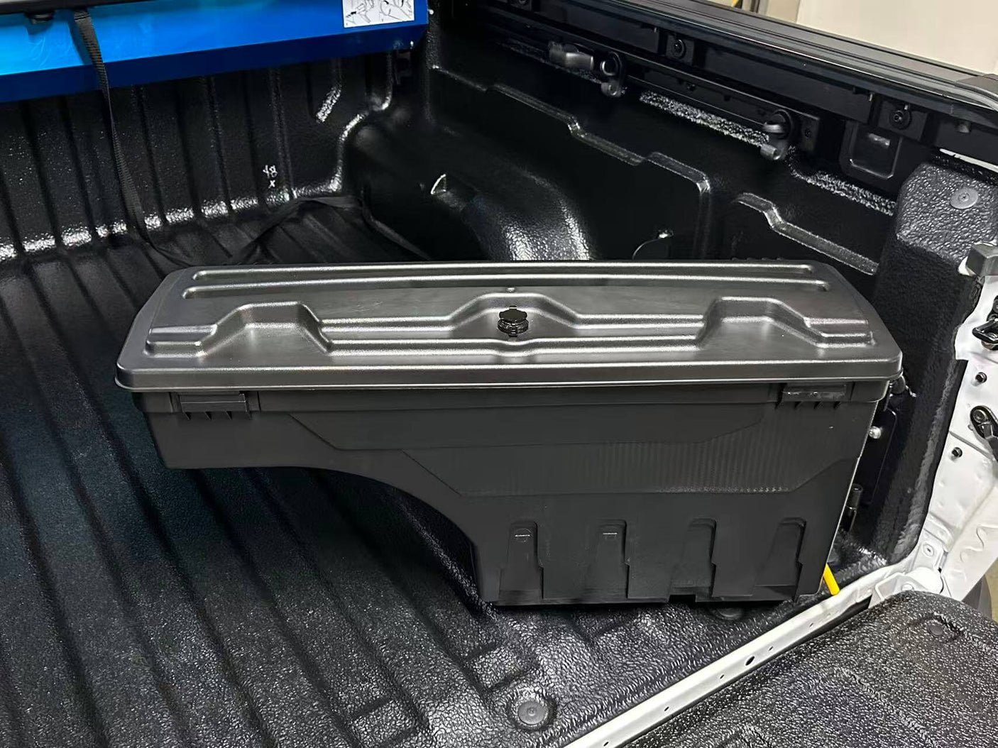 KIA Tasman Tool Box 2025+ Smart Swing-Out Ute Storage installed in vehicle tub showcasing practical and accessible design.