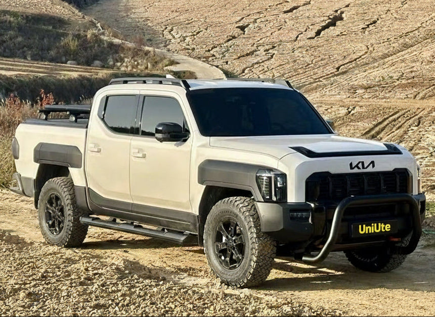 KIA Tasman nudge bar 2025+ model on a rugged trail, showcasing premium front protection and style.