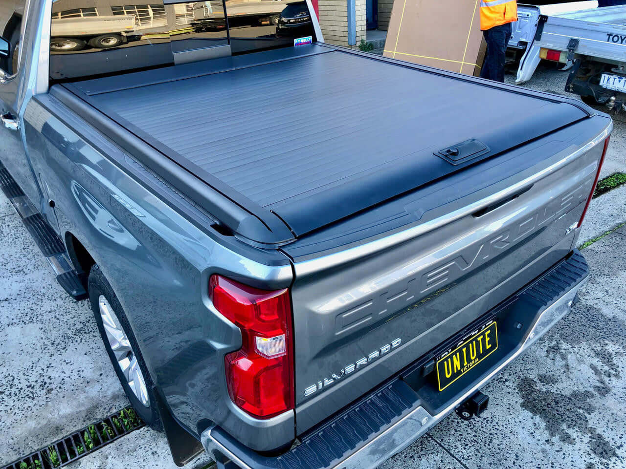 Chevrolet Silverado electric roller shutter — parked showing matte black slat design