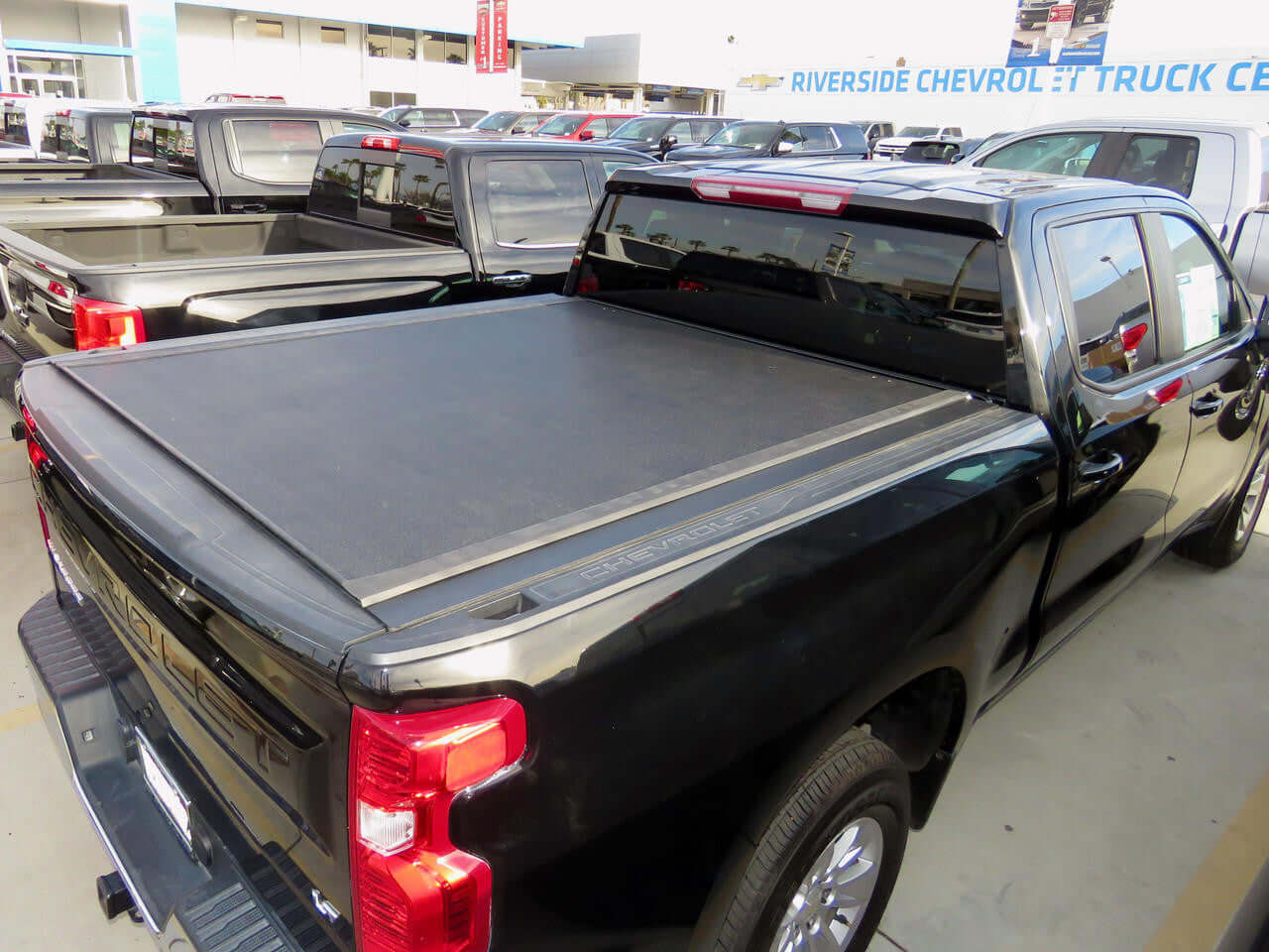 Silverado 1500 with REVOLVER cover — side view showing aluminium slat profile