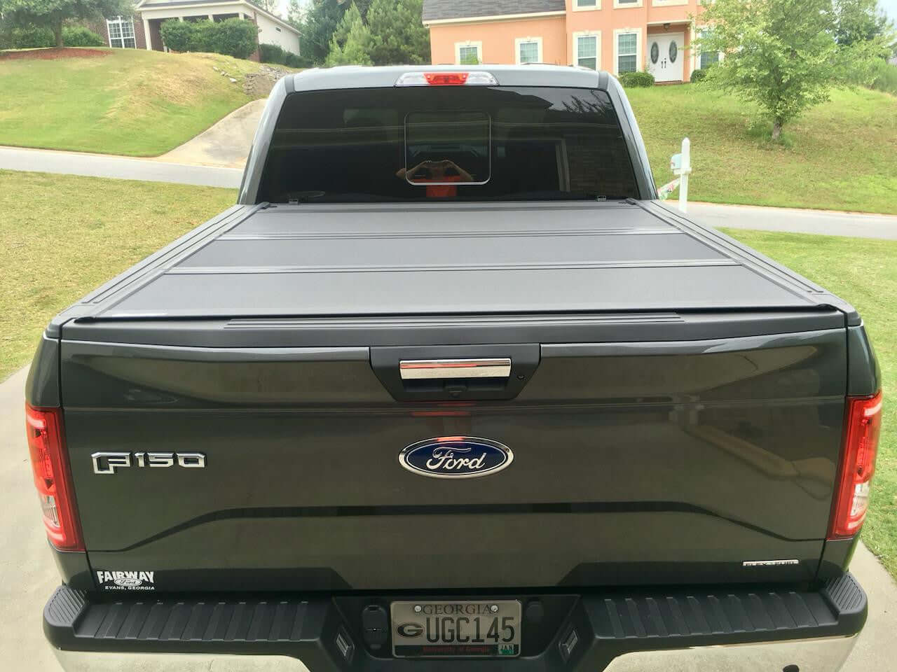 Ford F-150 5.5 quad-fold lid — panel open for tub access