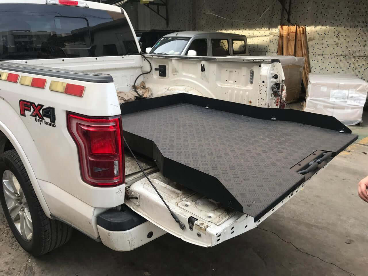 Ford F150 slide out tray displayed in a truck bed, enhancing storage and accessibility with UniUte Sliding Tray Drawer.