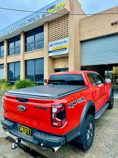 Red Ford Ranger Roller Shutter parked outside UniUte Accessories.