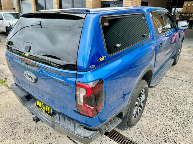 ford ranger canopy for NextGen 2022-2025, showcasing style and versatility in a parking area.