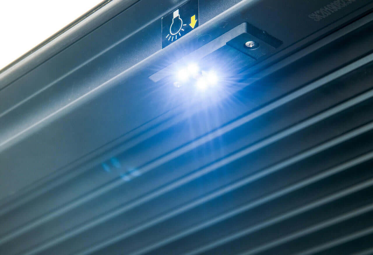 Close-up of the NextGen Ford 2022+ Gen2 Manual ranger roller shutter with integrated LED light for enhanced visibility.