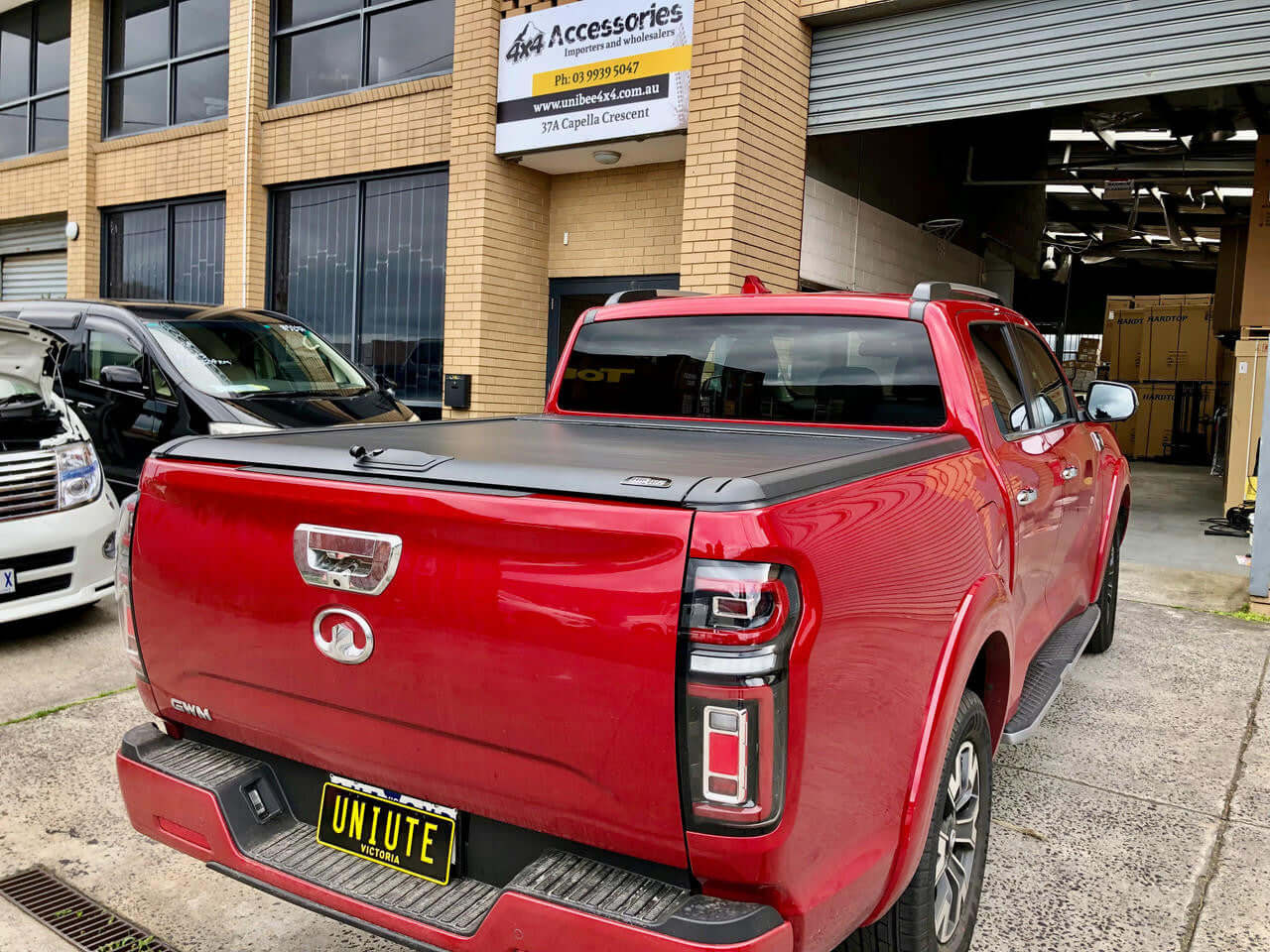 GWM Cannon roller cover on red ute with EGen2 electric shutter at UniUte store.