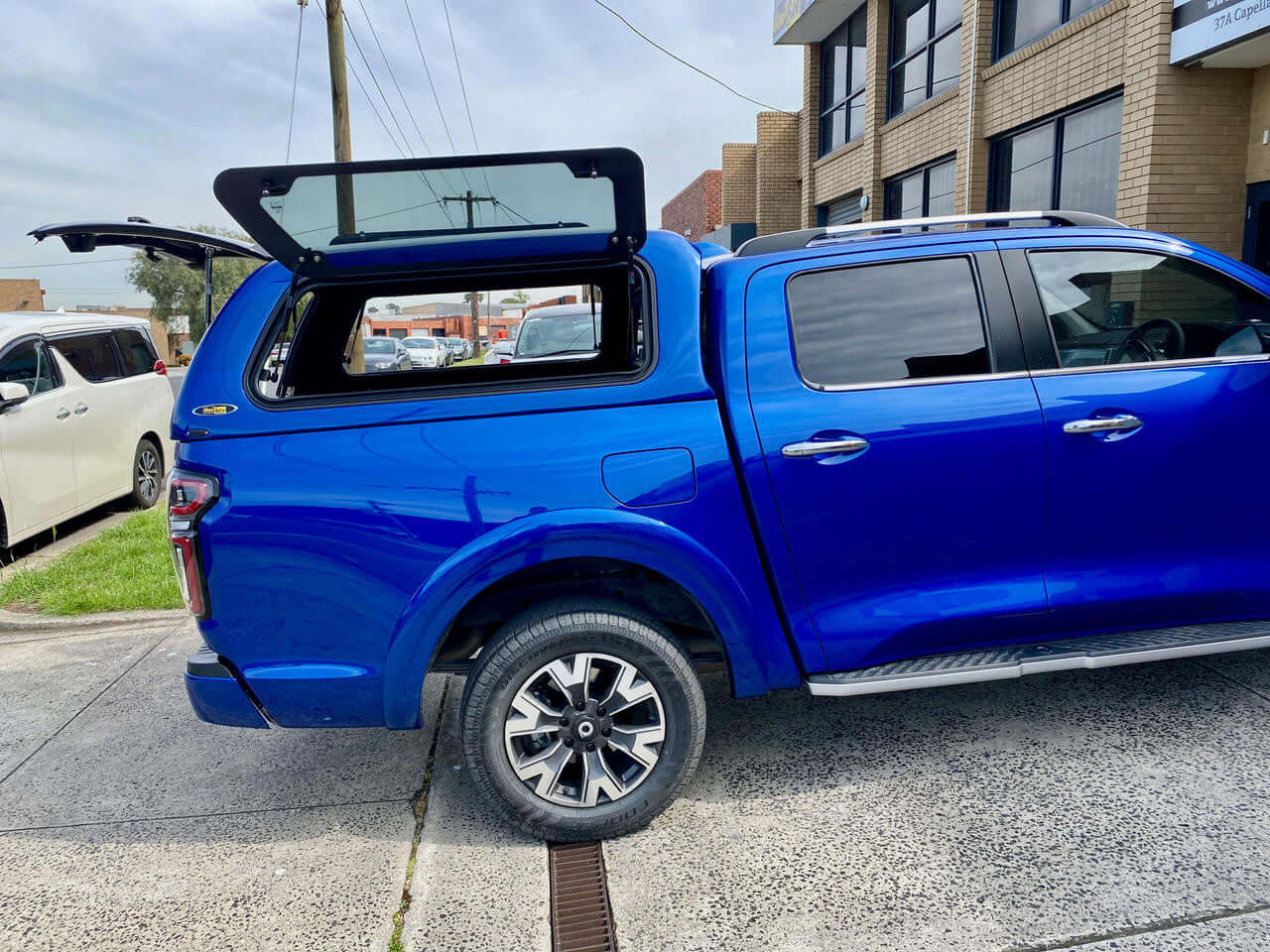 Blue Ute with UniUte FORCE PRO gwm cannon canopy for 2020-2025 models, showcasing premium design and functionality.