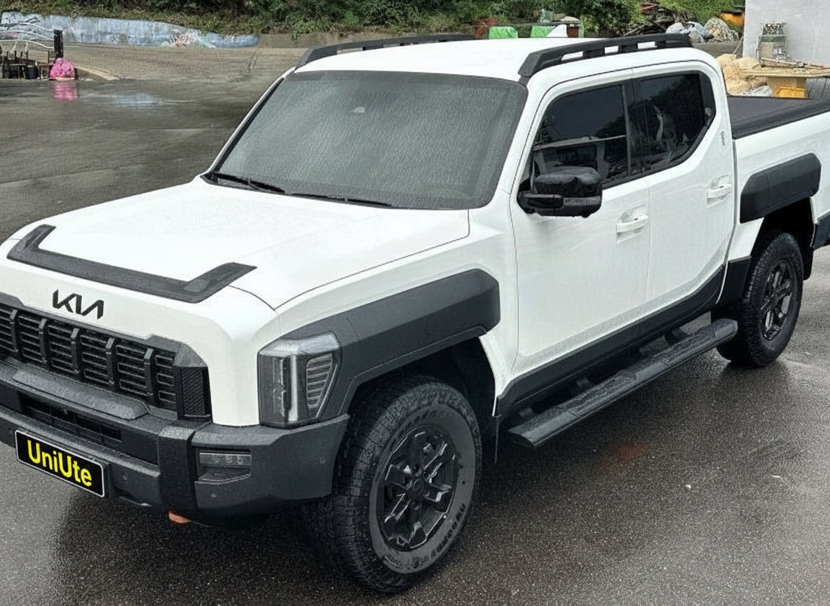 White truck equipped with Kia Tasman side steps 2025+ featuring black steel side bars for enhanced accessibility and rugged style.
