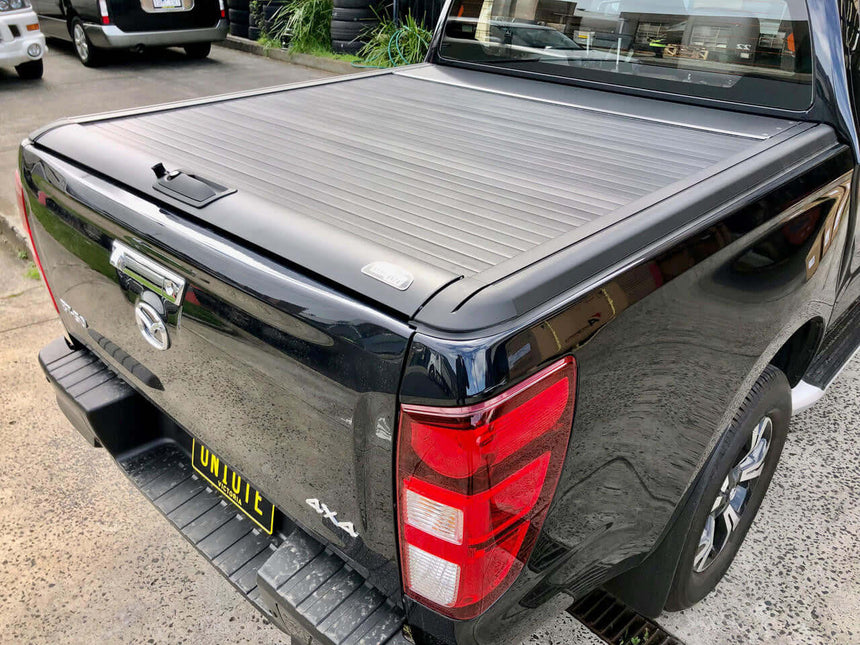 Black Isuzu DMax roller shutter on a 2021-2025 model ute enhancing security and style