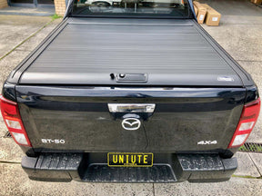 Electric roller shutter for Isuzu D-Max 2021-2026 — installed on black ute | UniUte