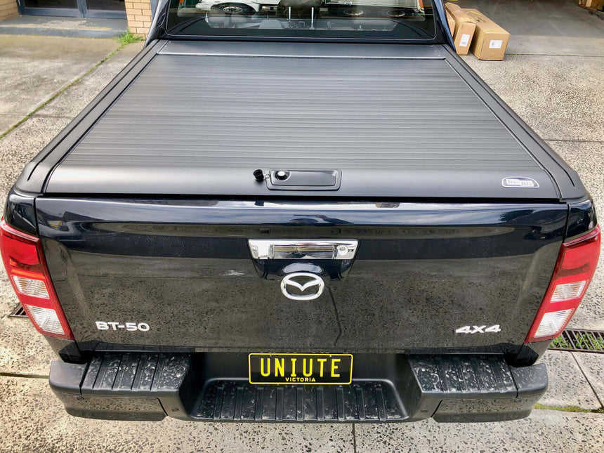 isuzu dmax roller shutter on a black ute showcasing the UniUte EGen2 Electric Shutter for Isuzu D-Max 2021-2025