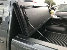 Quad-fold hard lid for Isuzu D-Max 2020-2026 — installed closed view | UniUte