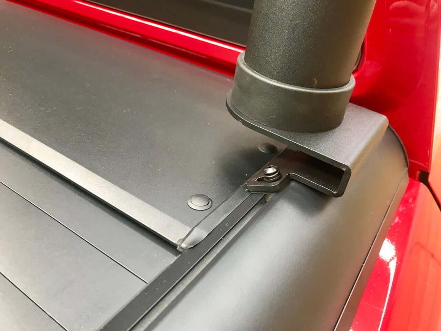 Close-up of ladder racks for roller shutters Gen1 & Gen2, showing detailed attachment on a red ute.