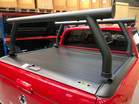 Ladder racks for Gen1 & Gen2 roller shutters on red ute, enhancing utility and carrying capacity.