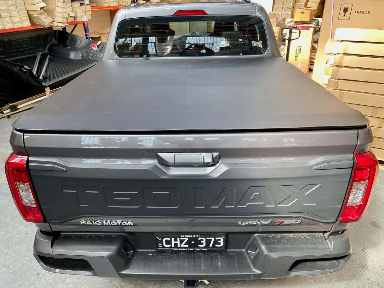LDV T60 Tonneau Cover 2017-2025 - Soft Roll Up Tonneau Cover installation on grey truck