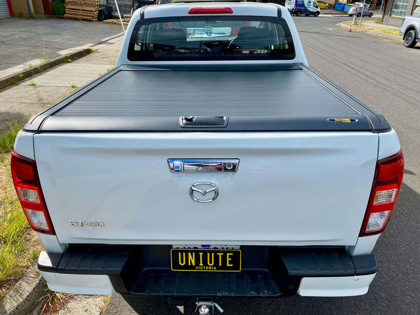 Mazda BT-50 with UniUte Gen2 manual roller cover showcasing bt50 roller shutter on parked truck