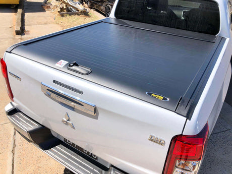 Triton roller shutter installed on a Mitsubishi MQ & MR 2015-2024 pickup truck, showcasing sleek design and enhanced utility.