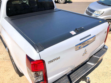 Mitsubishi Triton with UniUte Gen2 Manual Roller Shutter providing protection, specifically for Triton models 2015-2024. Focus: triton roller shutter.