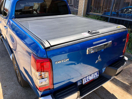 Blue Mitsubishi Triton with UniUte Gen2 triton roller shutter 2015-2024