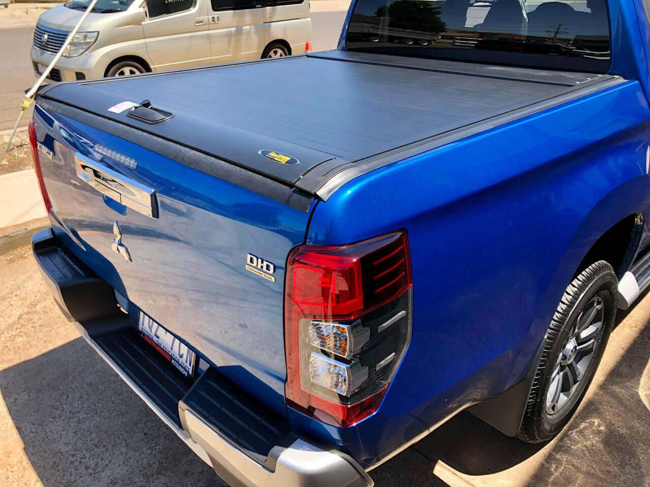 Side view of Mitsubishi Triton MQ MR (2015-2024) with UniUte Gen2 manual triton roller shutter, showcasing robust and stylish protection.