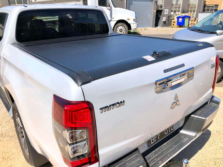 Triton roller shutter on a Mitsubishi Triton MQ truck, enhancing utility and protection, 2015-2024 model in urban setting