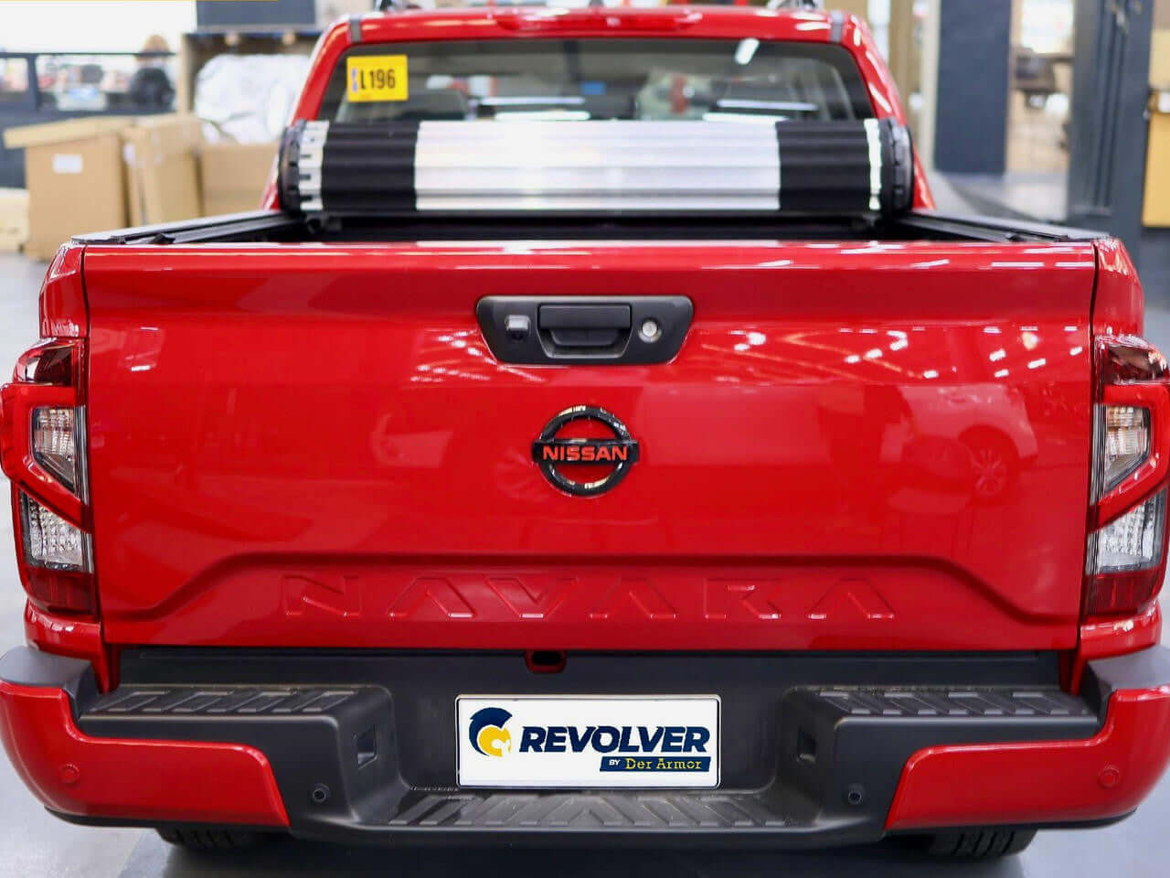 REVOLVER cover on Nissan Navara NP300 — partially rolled open showing access