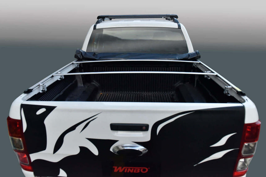 nissan navara cover tonneau on a pickup truck, showcasing soft roll up design and sleek aesthetics with open cargo area