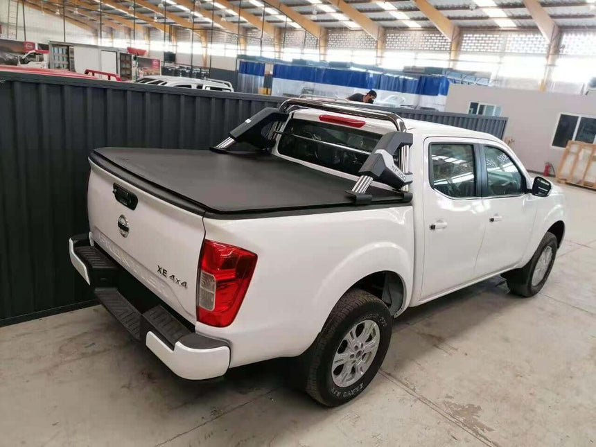 nissan navara cover tonneau soft roll up installed on white pickup truck