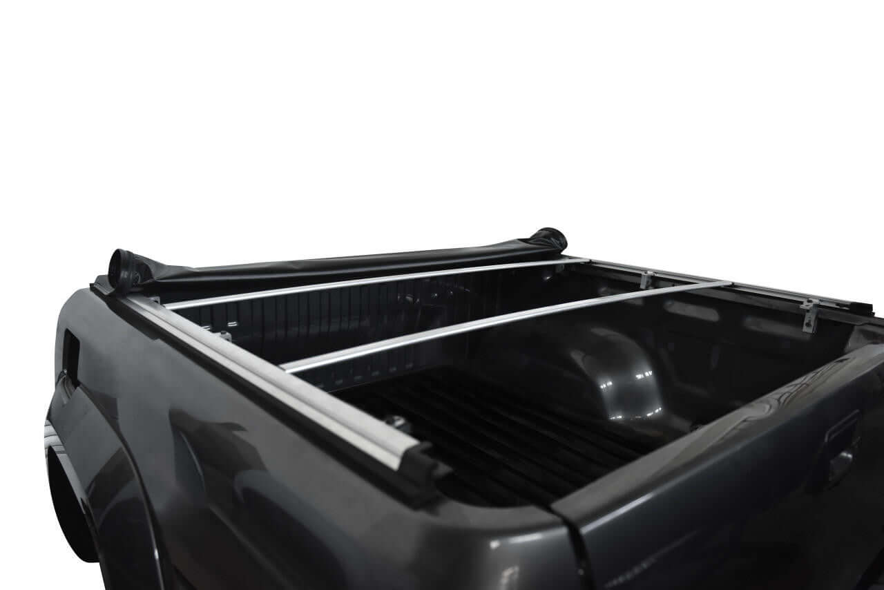 Soft roll-up nissan navara cover tonneau for NP300 2015-2020 showcasing open truck bed and rails.