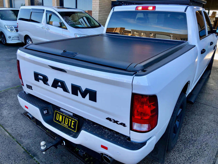 RAM 1500 roller shutter on white truck showing UniUte Gen2 Manual Cover
