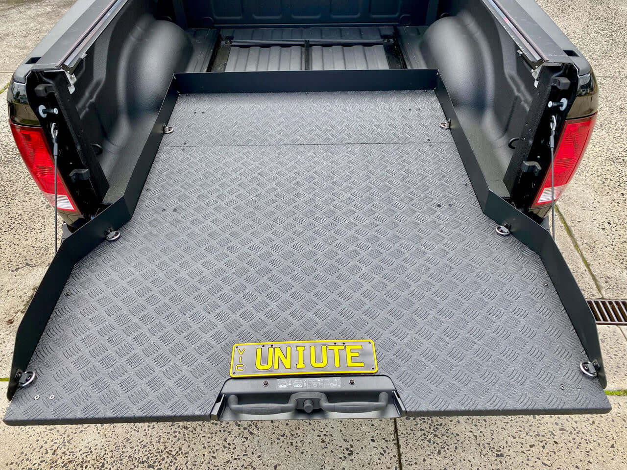 UniUte ute sliding tray for Dodge RAM 1500 5.7' bed, showcasing the ultimate cargo slide tray with enhanced utility and convenience.