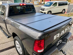 Tri-fold hard lid for RAM 1500 DS/DT 5.7 bed 2009-2026 — installed closed | UniUte