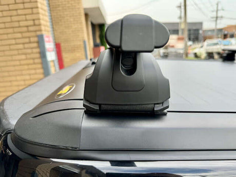 Close-up of roller shutter racks cross bars installed on a Gen2 Ute, featuring a sleek design and durable aircraft-grade alloy for rust prevention.