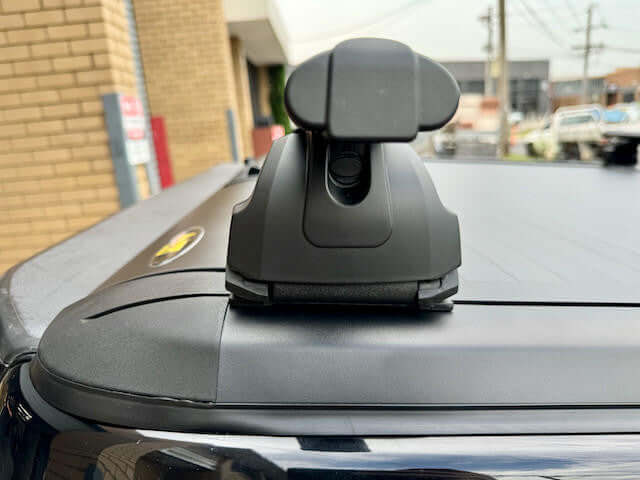 Close-up of roller shutter racks cross bars installed on a Gen2 Ute, featuring a sleek design and durable aircraft-grade alloy for rust prevention.