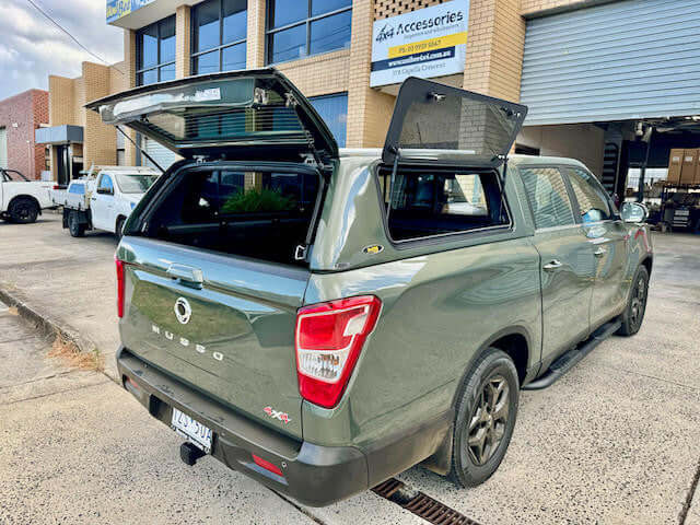 Canopy for SsangYong Musso XLV 2018-2025 installed on green truck for enhanced utility and style.