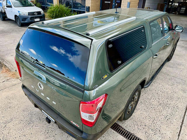 Green canopy for SsangYong Musso XLV Long Tub 2018-2025 parked outdoors