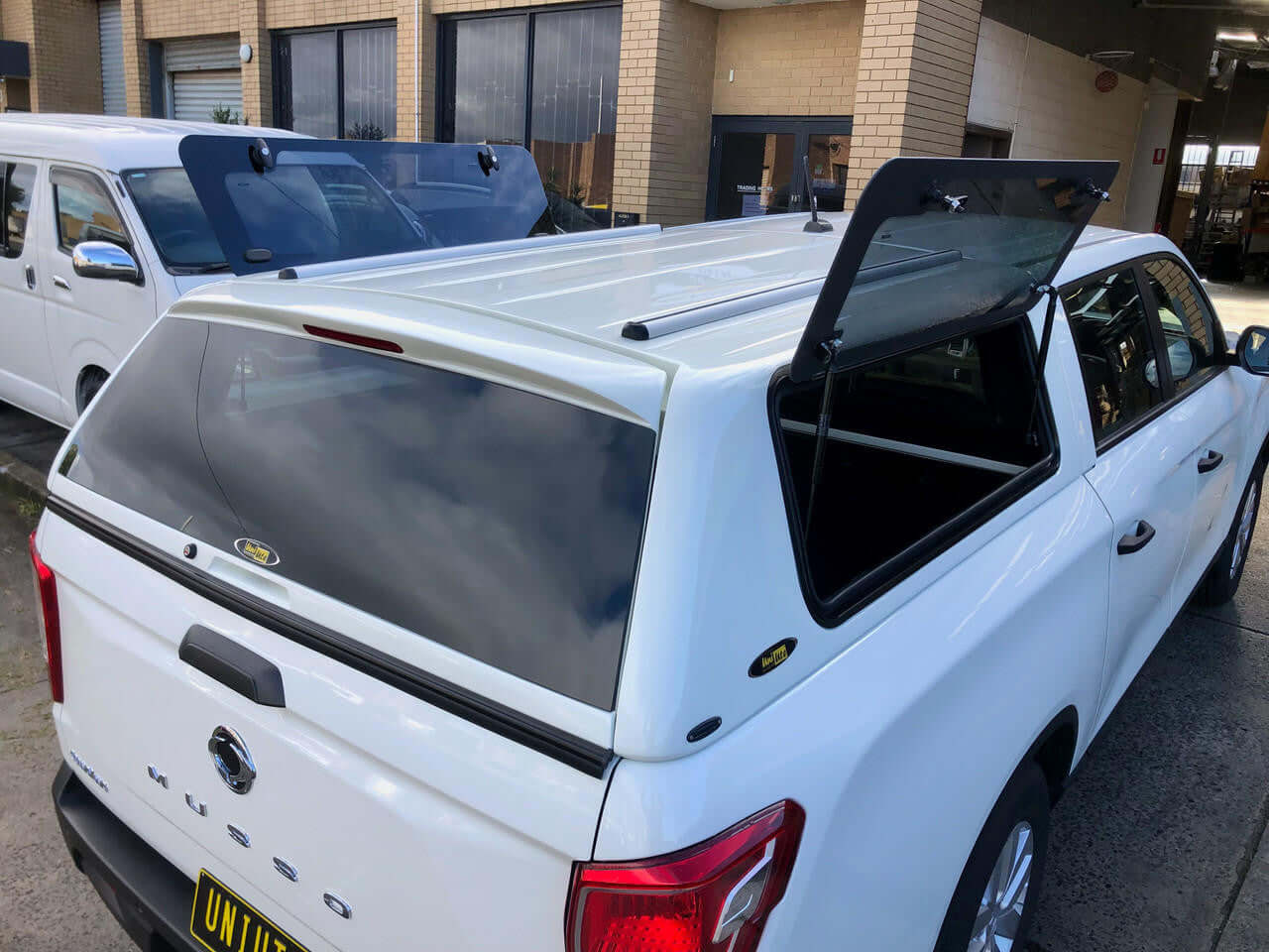 canopy for ssangyong musso XLV long tub 2018-2025 white Force Pro design by UniUte, city outdoor setting