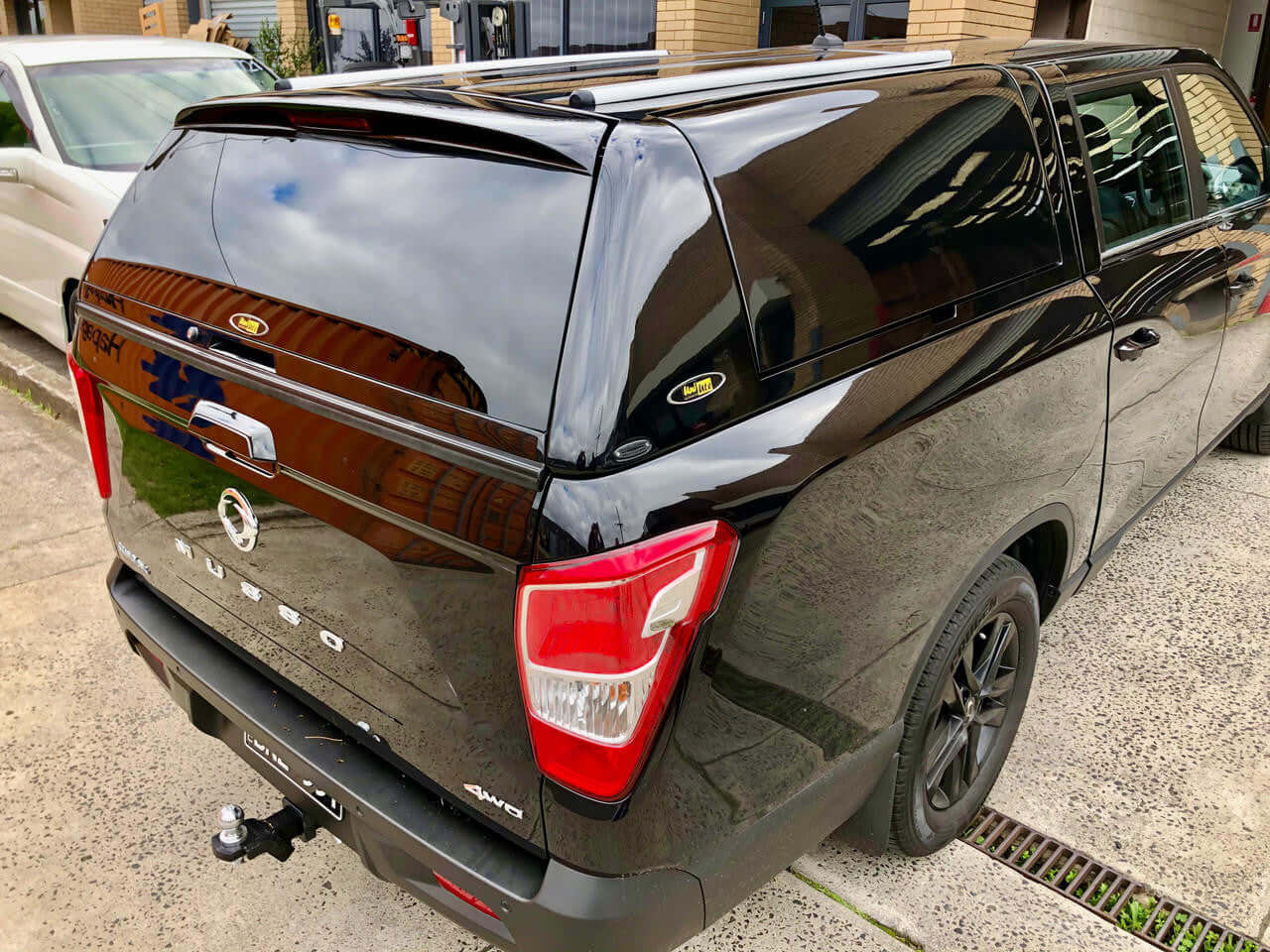 Black SsangYong Musso XLV Canopy FORCE PRO PLUS 2018-2025 on parked truck